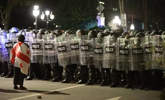Police block protesters during an opposition rally in the city center of Tbilisi, Georgia, on Saturday, Oct. 4, 2025, boycotting the municipal elections and call for the release of political opponents. (AP Photo/Zurab Tsertsvadze)