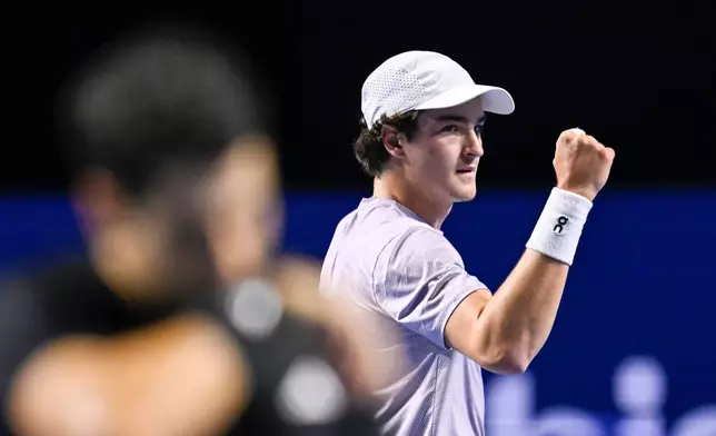 Brazil's Joao Fonseca reacts during his semi-final match against Spain's Jaume Munar at the Swiss Indoors tennis tournament at the St. Jakobshalle in Basel, Switzerland, Saturday, Oct. 25, 2025. (Georgios Kefalas/Keystone via AP)