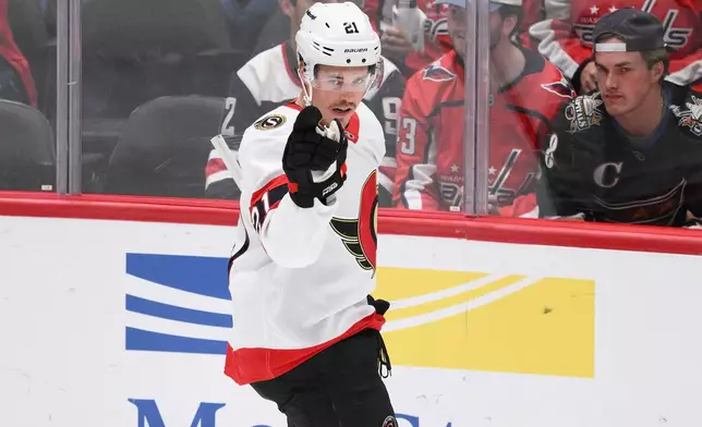 Ottawa Senators center Nick Cousins (21) celebrates his goal during the second period of an NHL hockey game against the Washington Capitals, Saturday, Oct. 25, 2025, in Washington. (AP Photo/Nick Wass)