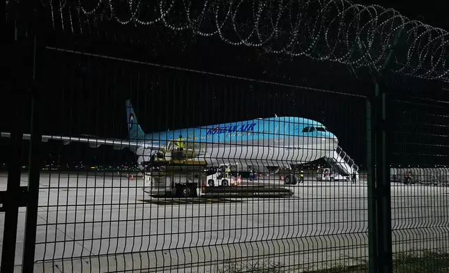 A Korean Air plane is seen at the VIP section for chartered planes at Techo International Airport in Kandal province, Cambodia, Friday, Oct. 17, 2025. (AP Photo/Heng Sinith)
