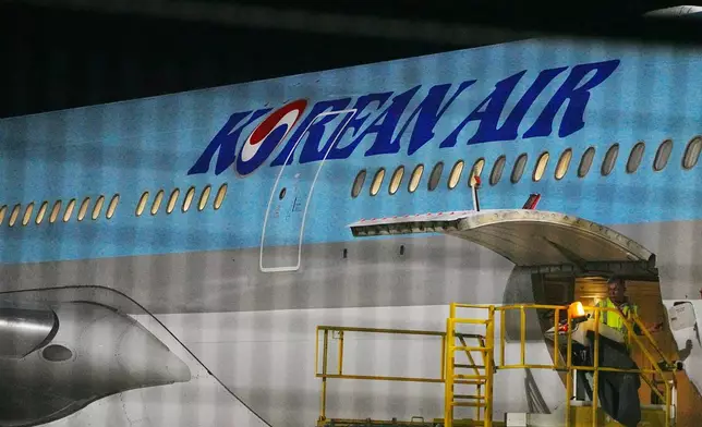 A Korean Air plane is seen at the VIP section for chartered planes at Techo International Airport in Kandal province, Cambodia, Friday, Oct. 17, 2025. (AP Photo/Heng Sinith)