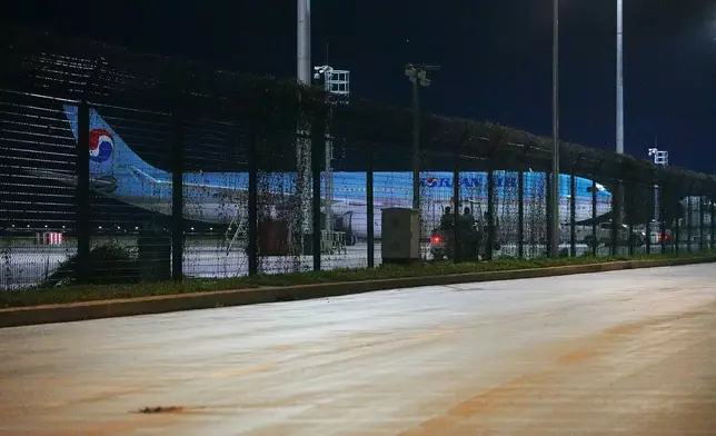 A Korean Air plane is seen at the VIP section for chartered planes at Techo International Airport in Kandal province, Cambodia, Friday, Oct. 17, 2025. (AP Photo/Heng Sinith)