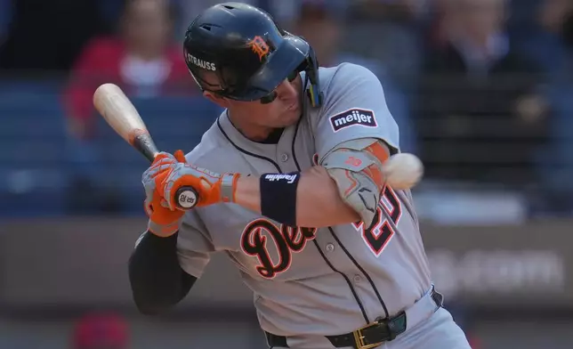 Detroit Tigers' Spencer Torkelson is hit by a pitch in the ninth inning of Game 2 of the American League Wild Card baseball playoff series against the Cleveland Guardians in Cleveland, Wednesday, Oct. 1, 2025. (AP Photo/Sue Ogrocki)