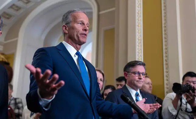 Senate Majority Leader John Thune, R-S.D., is joined by Speaker of the House Mike Johnson, R-La., right, as they speak with reporters following a closed-door Republican strategy session as the government shutdown heads toward a second week, at the Capitol in Washington, Tuesday, Oct. 7, 2025. (AP Photo/J. Scott Applewhite)