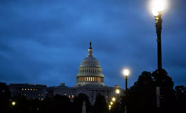 Early morning cloudy skies over the U.S. Capitol during the 8th day of the government shutdown on Wednesday, Oct. 8, 2025, in Washington. (AP Photo/John McDonnell)