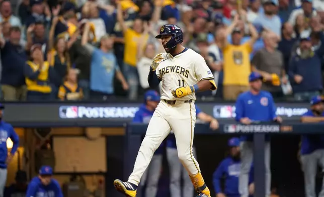 Milwaukee Brewers' Jackson Chourio (11) celebrates while running the bases after hitting a 3-run home run during the fourth inning of Game 2 of baseball's National League Division Series against the Chicago Cubs Monday, Oct. 6, 2025, in Milwaukee. (AP Photo/Kayla Wolf)