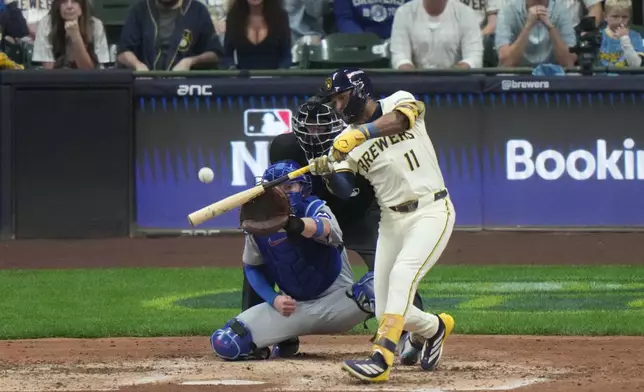 Milwaukee Brewers' Jackson Chourio (11) hits a 3-run home run during the fourth inning of Game 2 of baseball's National League Division Series against the Chicago Cubs Monday, Oct. 6, 2025, in Milwaukee. (AP Photo/Morry Gash)