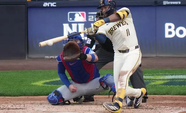 Milwaukee Brewers' Jackson Chourio hits an RBI single during the second inning of Game 1 of baseball's National League Division Series against the Chicago Cubs Saturday, Oct. 4, 2025, in Milwaukee. (AP Photo/Morry Gash)