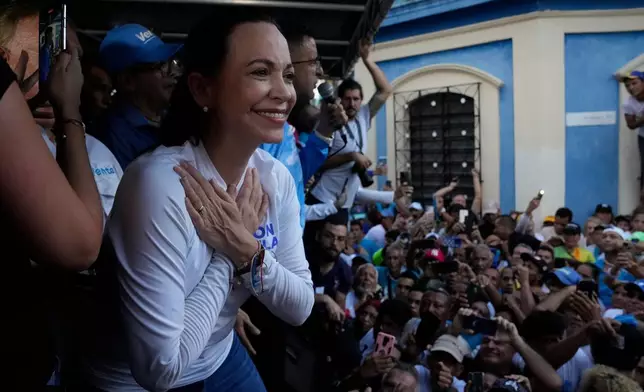 FILE - Opposition presidential hopeful Maria Corina Machado gestures to supporters during a rally in Valencia, Carabobo state, Venezuela, Thursday, Oct. 5, 2023. (AP Photo/Ariana Cubillos, File)