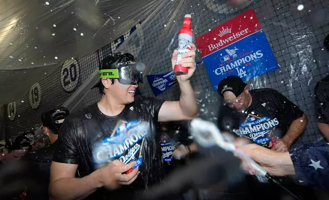 Los Angeles Dodgers pitcher Shohei Ohtani celebrates their win against the Milwaukee Brewers in baseball's National League Championship Series, Friday, Oct. 17, 2025, in Los Angeles.(AP Photo/Ashley Landis)