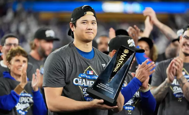 Los Angeles Dodgers pitcher Shohei Ohtani celebrates their win against the Milwaukee Brewers in baseball's National League Championship Series, Friday, Oct. 17, 2025, in Los Angeles.(AP Photo/Brynn Anderson)