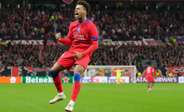 PSG's Desire Doue celebrates after scoring his side's second goal during a Champions League opening phase soccer match between Bayer Leverkusen and Paris Saint-Germain in Leverkusen, Germany, Tuesday, Oct. 21, 2025. (AP Photo/Martin Meissner)