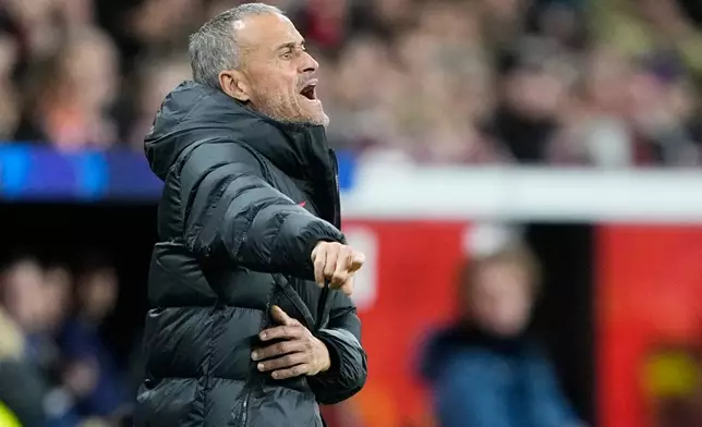 PSG's head coach Luis Enrique gestures during a Champions League opening phase soccer match between Bayer Leverkusen and Paris Saint-Germain in Leverkusen, Germany, Tuesday, Oct. 21, 2025. (AP Photo/Martin Meissner)