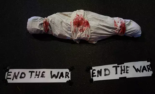 A display during a protest in Tel Aviv, Israel, on Tuesday, Sept. 30, 2025, calling for the immediate release of all hostages held by Hamas in the Gaza Strip and an end to the ongoing war. (AP Photo/Ariel Schalit)