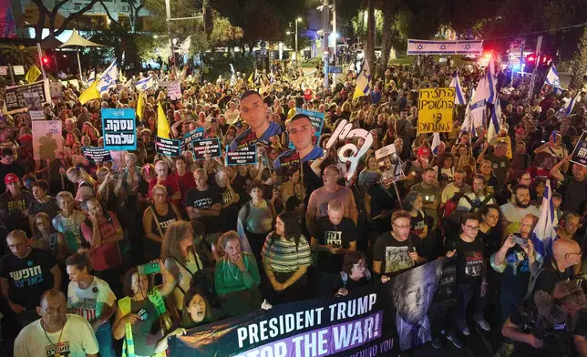 Demonstrators march in Tel Aviv, Israel, on Tuesday, Sept. 30, 2025, calling for the immediate release of all hostages held by Hamas in the Gaza Strip and an end to the ongoing war. (AP Photo/Ariel Schalit)