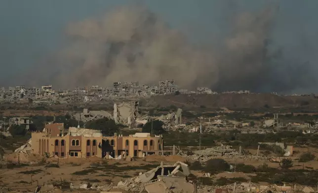 Smoke rises following an Israeli military strike in Gaza City, as seen from the central Gaza Strip, Wednesday, Oct, 1, 2025. (AP Photo/Jehad Alshrafi)
