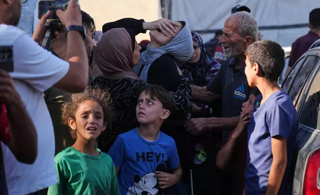 Nahrawan al-Khatib, mourns her husband, Yahya Barzaq, who was killed in an Israeli strike on Deir al-Balah, Gaza Strip, Wednesday, Oct. 1, 2025. (AP Photo/Abdel Kareem Hana)
