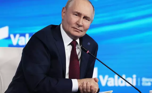 Russian President Vladimir Putin answers questions during a meeting with foreign policy experts at the Valdai Discussion Club in the Black Sea resort of Sochi, Russia, on Thursday, Oct. 2, 2025. (Mikhail Metzel, Sputnik, Kremlin Pool Photo via AP)