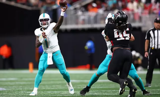 Miami Dolphins quarterback Tua Tagovailoa (1) throws during the first half of an NFL football game against the Atlanta Falcons, Sunday, Oct. 26, 2025, in Atlanta. (AP Photo/Colin Hubbard)
