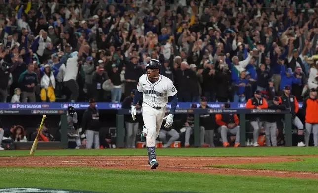 Seattle Mariners second baseman Jorge Polanco reacts after hitting an RBI-single for shortstop J.P. Crawford to score the game-winning run during the 15th inning in Game 5 of baseball's American League Division Series against the Detroit Tigers, Friday, Oct. 10, 2025, in Seattle. (AP Photo/Lindsey Wasson)