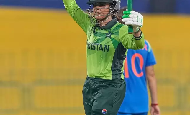 Pakistan's Sidra Amin celebrates her fifty runs during the ICC Women's Cricket World Cup match between India and Pakistan at Premadasa Stadium in Colombo, Sri Lanka, Sunday, Oct, 5, 2025. (AP Photo/Eranga Jayawardena)
