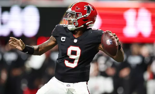 Atlanta Falcons quarterback Michael Penix Jr. (9) throws a pass during the first half of an NFL football game against the Buffalo Bills, Monday, Oct. 13, 2025, in Atlanta. (AP Photo/Colin Hubbard)