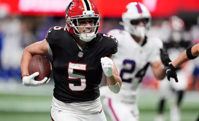 Atlanta Falcons wide receiver Drake London (5) runs after a catch during the first half of an NFL football game against the Buffalo Bills, Monday, Oct. 13, 2025, in Atlanta. (AP Photo/Mike Stewart)