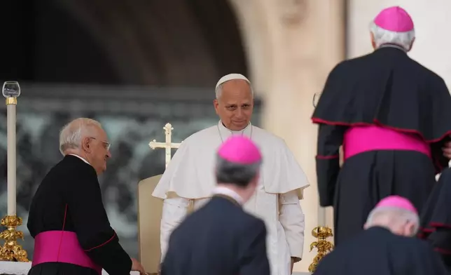 Pope Leo XIV meets Cardinals and Bishops during an audience with pilgrims of the Diocesan Jubilee in St. Peter's Square, at the Vatican, Saturday, Oct. 25, 2025. (AP Photo/Alessandra Tarantino)
