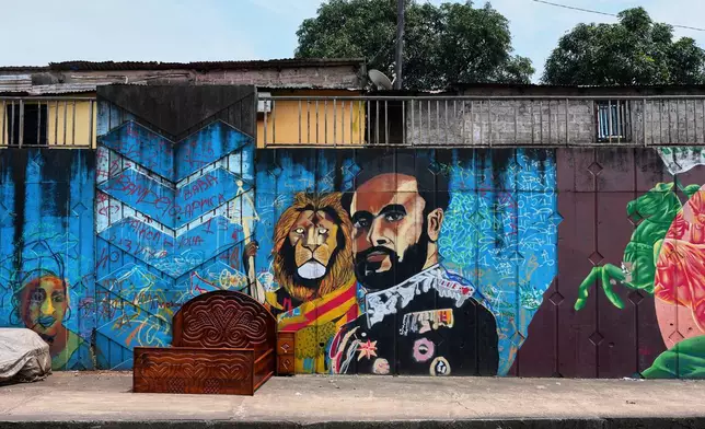 A mural depicting Haile Selassie painted by Omar Diaw on a street wall in Conakry, Guinea, Saturday, Sep. 20, 2025. (AP Photo/Misper Apawu)