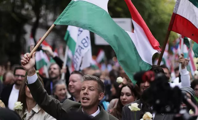 The leader of the Hungarian opposition TISZA party, Peter Magyar, rallies during a demonstration marking the 69th anniversary of the outbreak of Hungary's 1956 revolution against communist rule and the Soviet Union, in Budapest, Hungary, Thursday, Oct. 23, 2025. (AP Photo/Rudolf Karancsi)