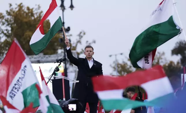 The leader of the Hungarian opposition TISZA party, Peter Magyar, during a demonstration marking the 69th anniversary of the outbreak of Hungary's 1956 revolution against communist rule and the Soviet Union, in Budapest, Hungary, Thursday, Oct. 23, 2025. (AP Photo/Rudolf Karancsi)