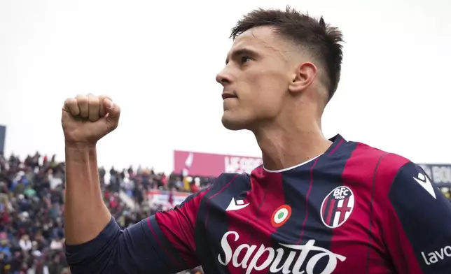 Bologna's Nikola Moro celebrates after scoring his side's second goal during a Serie A soccer match between Bologna and Pisa at the Renato Dall'Ara Stadium in Bologna, Italy, Sunday, Oct. 5, 2025. (Massimo Paolone/LaPresse via AP)