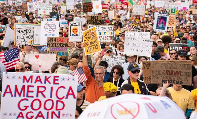Crowds gather to listen to Sen. Bernie Sanders, I-Vt., during a No Kings protest, Saturday, Oct. 18, 2025, in Washington. (AP Photo/Allison Robbert)