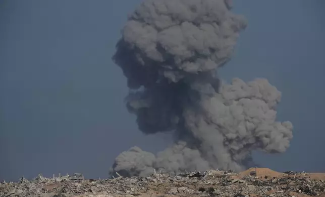 Smoke rises following an Israeli army bombardment in the Gaza Strip, as seen from southern Israel, Tuesday, Sept. 30, 2025. (AP Photo/Ohad Zwigenberg)
