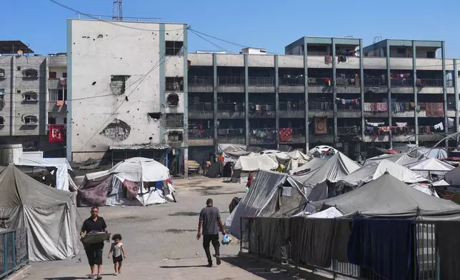 Tents are seen at UN school used as a shelter for displaced Palestinians in Khan Younis, Tuesday, Sept 30, 2025. (AP Photo/Jehad Alshrafi)