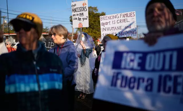 Protesters gather outside an ICE processing facility in the Chicago suburb of Broadview, Ill., Friday, Oct. 31, 2025. (AP Photo/Nam Y. Huh)
