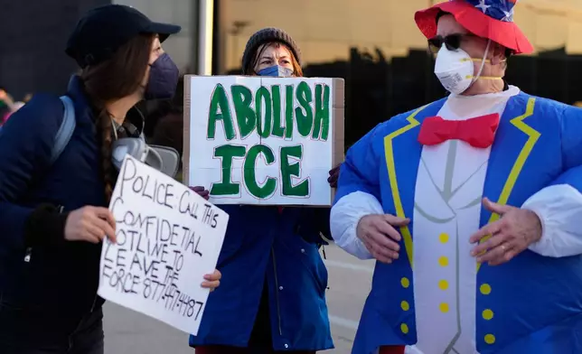 Protesters gather outside an ICE processing facility in the Chicago suburb of Broadview, Ill., Friday, Oct. 31, 2025. (AP Photo/Nam Y. Huh)