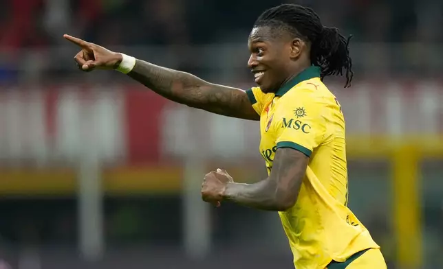 AC Milan's Rafael Leao celebrates scoring his side's first goal during a Serie A soccer match between AC Milan and Fiorentina in Milan, Italy, Sunday, Oct. 19, 2025. (AP Photo/Luca Bruno)