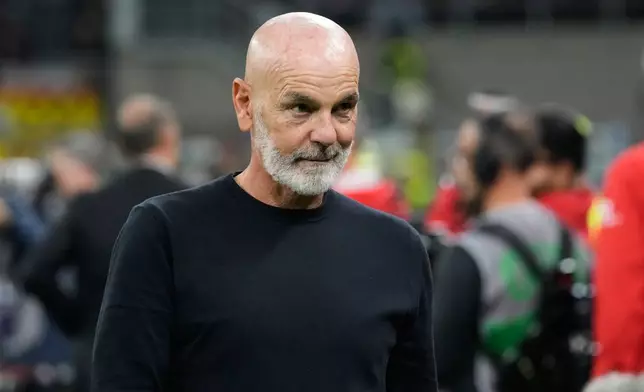Fiorentina's head coach Stefano Pioli enters to the pitch prior to a Serie A soccer match between AC Milan and Fiorentina, in Milan, Italy, Sunday, Oct. 19, 2025. (AP Photo/Luca Bruno)