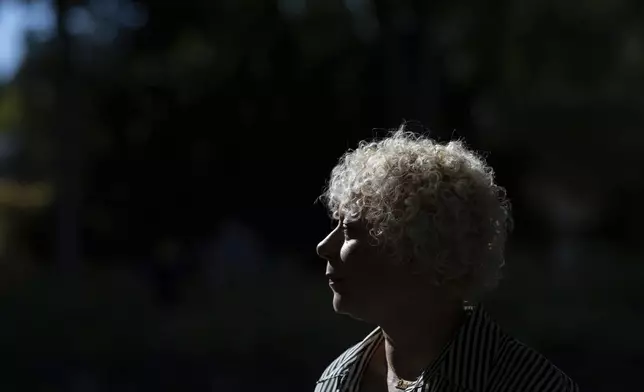 Brianna Wheeler poses for a photo at Peninsula Park, Monday, Sept. 22, 2025, in Portland, Ore. (AP Photo/Jenny Kane)
