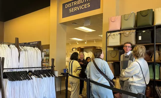 Members of The Church of Jesus Christ of Latter-day Saints shop for new sleeveless sacred garments at Deseret Book in Salt Lake City on Tuesday, Oct. 28, 2025. (AP Photo/Hannah Schoenbaum)