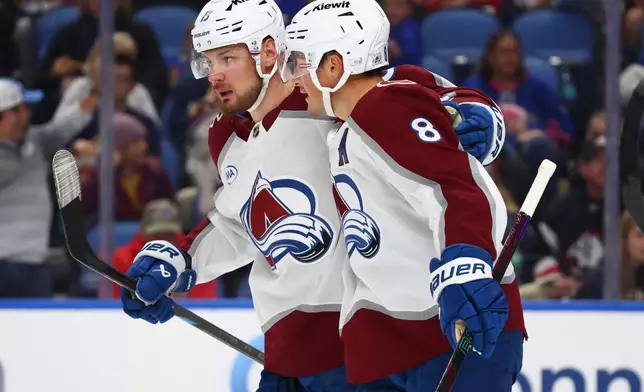 Colorado Avalanche defenseman Cale Makar (8) right, celebrates his goal with right wing Valeri Nichushkin (13) during the second period of an NHL hockey game against the Buffalo Sabres Monday, Oct. 13, 2025, in Buffalo, N.Y. (AP Photo/Jeffrey T. Barnes)