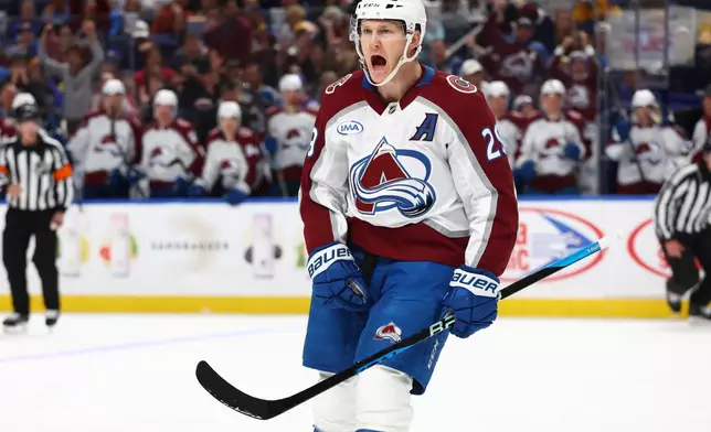 Colorado Avalanche center Nathan MacKinnon (29) celebrates his goal during the second period of an NHL hockey game against the Buffalo Sabres Monday, Oct. 13, 2025, in Buffalo, N.Y. (AP Photo/Jeffrey T. Barnes)