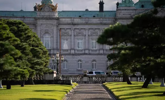 Cars, including an American Ford F-150 truck are seen in the courtyard of the Akasaka Palace during President Donald Trump's visit in Japan, in Tokyo, Tuesday, Oct. 28, 2025. (AP Photo/Louise Delmotte)