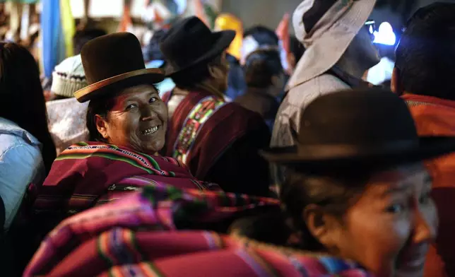 Suppoters of presidential candidate Rodrigo Paz celebrate after preliminary results showed him leading in the presidential runoff election in La Paz, Bolivia, Sunday, Oct. 19, 2025. (AP Photo/Ivan Valencia)