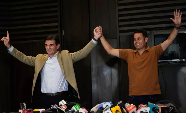CORRECTS PEDRO TO EDMAN LARA - President-elect Rodrigo Paz, left, and his running mate Edman Lara give a press conference in La Paz, Bolivia, Monday, Oct. 20, 2025. (AP Photo/Juan Karita)