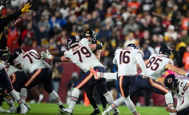 Chicago Bears kicker Jake Moody has his field goal attempt blocked during the second half of an NFL football game against the Washington Commanders, Monday, Oct. 13, 2025, in Landover, Md. (AP Photo/Nick Wass)