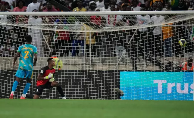 Rwanda's goalkeeper Fiacre Ntwari watches the ball as South Africa's Oswin Appollis scores his side's second goal during a World Cup 2026 group C qualifying soccer match between South Africa and Rwanda at Mbombela Stadium, in Nelspruit, South Africa, Tuesday, Oct. 14, 2025. (AP Photo/Themba Hadebe)