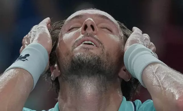 Arthur Rinderknech of France reacts after defeating Daniil Medvedev of Russia in their men's singles semifinal match of the Shanghai Masters tennis tournament at Qizhong Forest Sports City Tennis Center, in Shanghai, China, Saturday, Oct. 11, 2025. (AP Photo/Andy Wong)