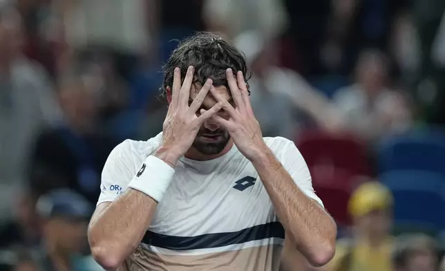 Valentin Vacherot of Monaco reacts after defeating Novak Djokovic of Serbia in the men's singles semifinal match of the Shanghai Masters tennis tournament at Qizhong Forest Sports City Tennis Center, in Shanghai, China, Saturday, Oct. 11, 2025. (AP Photo/Andy Wong)